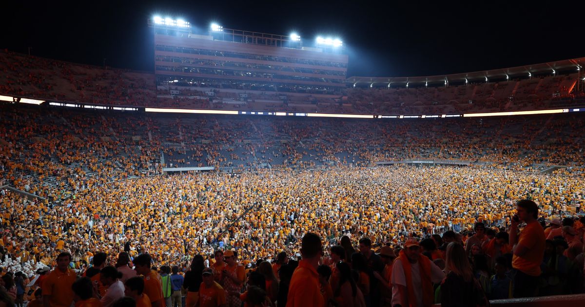 Tennessee fans rush the field after the Volunteers defeated the Alabama Crimson Tide at Neyland Stadium in Knoxville on Saturday.