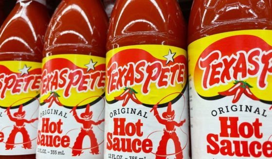 bottles of Texas Pete hot sauce on a store shelf