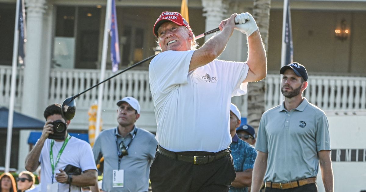 Former President Donald Trump tees off during a visit a day ahead of the LIV Golf Invitational Miami at Trump National Doral Miami golf club in Miami on Thursday.