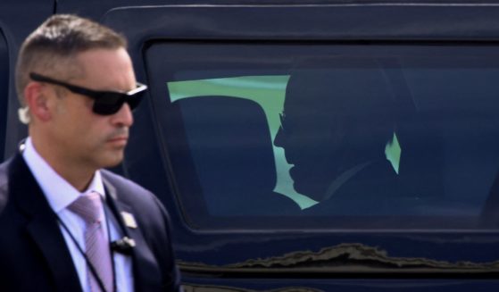 A Secret Service agent stands guard as  President Joe Biden arrives at Delaware National Guard Air Base on June 18, 2021, in New Castle, Delaware.
