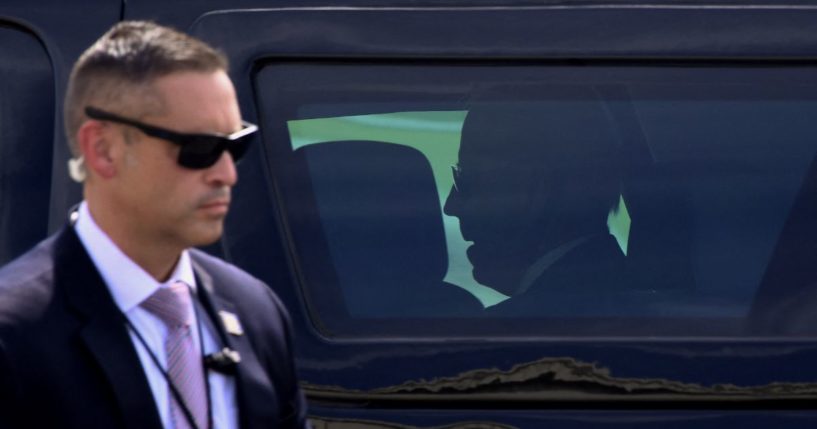 A Secret Service agent stands guard as  President Joe Biden arrives at Delaware National Guard Air Base on June 18, 2021, in New Castle, Delaware.