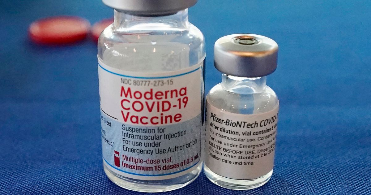 Vials of the Moderna and Pfizer COVID-19 vaccinations are shown in a September 2021 photo.