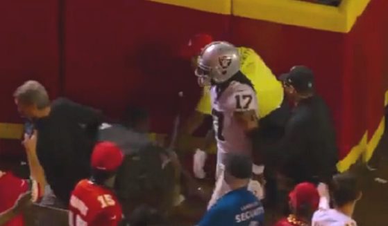 Las Vegas Raiders star receiver Davante Adams stalks from the field at Arrowhead Statdium Monday after pushing a man to the ground.