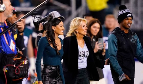 First lady Jill Biden walks on the field for the coin toss ahead of Sunday night's NFL football game between the Philadelphia Eagles and Dallas Cowboys at Philadelphia's Lincoln Financial Field.