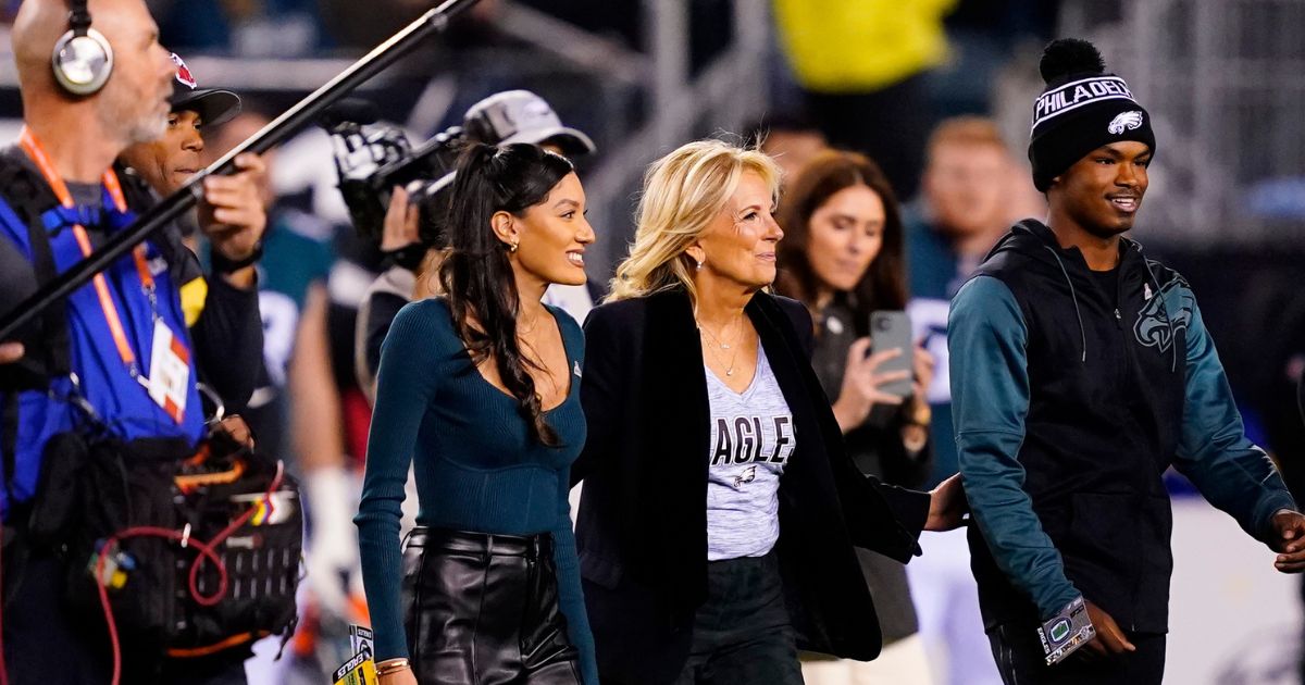 First lady Jill Biden walks on the field for the coin toss ahead of Sunday night's NFL football game between the Philadelphia Eagles and Dallas Cowboys at Philadelphia's Lincoln Financial Field.