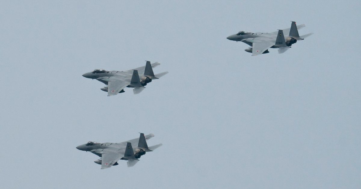 Japanese Air Self-Defense Force F-15 fighter jets are pictured in a file photo from the 2020 graduation ceremony at the Japanese National Defense Academy in Yokosuka, Japan.