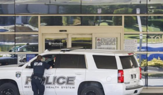 Police outside Methodist Dallas Medical Center on Saturday, where a gunman killed two.