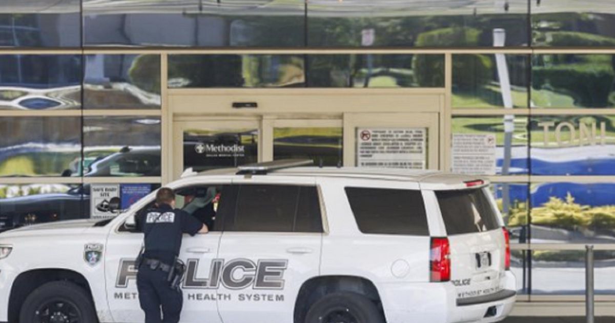 Police outside Methodist Dallas Medical Center on Saturday, where a gunman killed two.