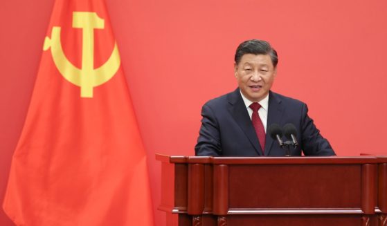 Chinese President Xi Jinping speaks at the podium during the meetingof the Standing Committee of the Chinese Communist Party's Politburo in Beijing on Sunday.