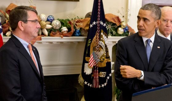 Then-Defense Secretary nominee Ashton Carter, left, and then-President Barack Obama, right, in a 2014 file photo.