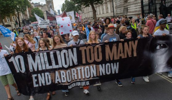 Participants in the anti-abortion 10 Million Lives Too Many march proceed up Whitehall on Sept. 3 in London.