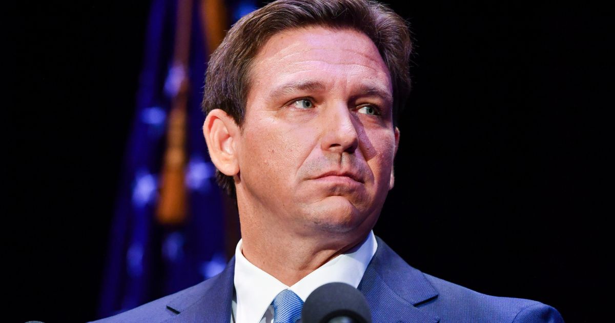 Florida's Republican Gov. Ron DeSantis takes the stage for a debate against Democratic opponent Charlie Crist in Fort Pierce, Florida, on Monday.