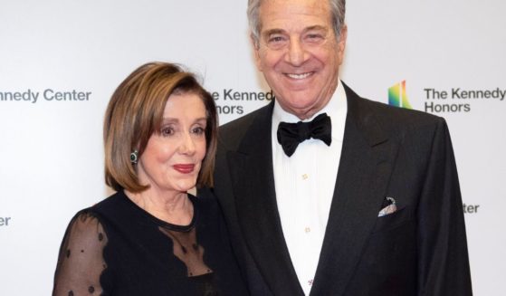 House Speaker Nancy Pelosi and her husband, Paul Pelosi, arrive at the State Department for the Kennedy Center Honors State Department Dinner in Washington on Dec. 7, 2019.