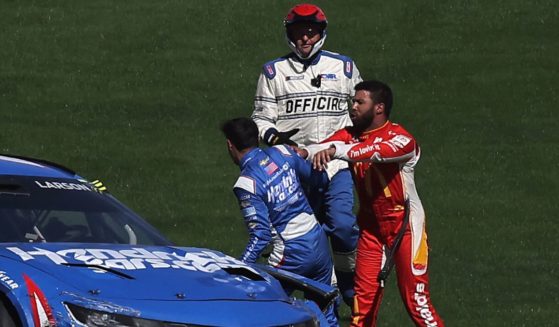 Bubba Wallace, driver of the No. 45 McDonald's Toyota, attacks Kyle Larson, driver of the No. 5 HendrickCars.com Chevrolet, after an on-track incident during the NASCAR Cup Series South Point 400 at Las Vegas Motor Speedway on Sunday.