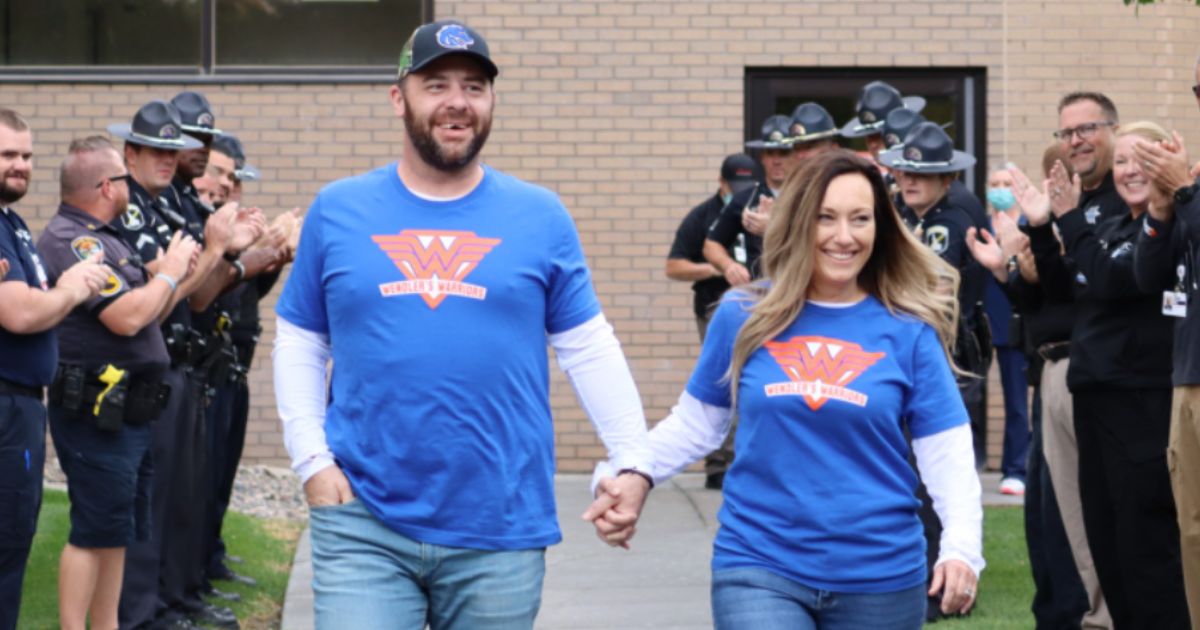 Sgt. Mike Wendler and his wife, Amy Wendler, walk out of Eastern Idaho Regional Medical Center on Saturday almost a month after a distracted driver ran into Mike, giving him a traumatic brain injury.