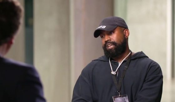 Ye talking with Tucker Carlson during an interview