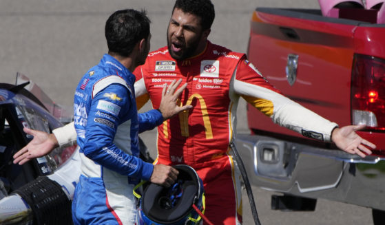Bubba Wallace, right, argues with Kyle Larson after the two crashed during a NASCAR Cup Series auto race Oct. 16 in Las Vegas.