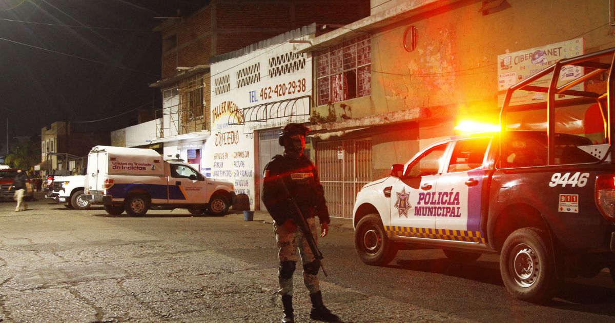 Members of the National Guard stand by the bar where 12 people were killed by an armed group which opened fire on customers and staff, in Irapuato, state of Guanajuato, Mexico, on Saturday.