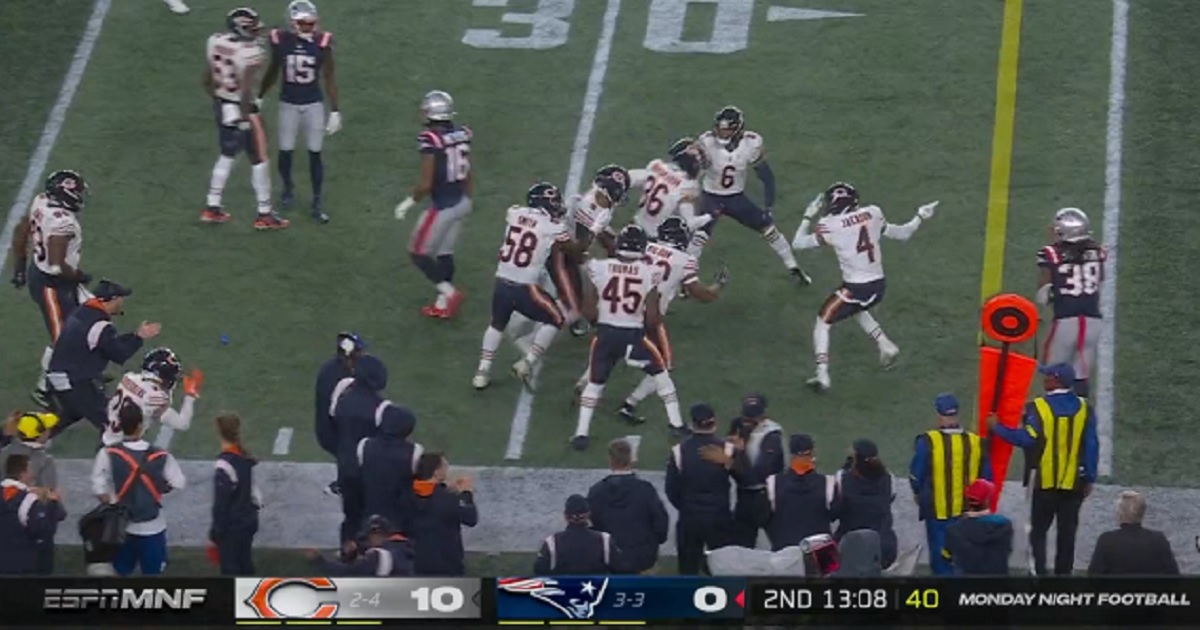Chicago Bears players celebrate after an interception Monday against the New England Patriots.