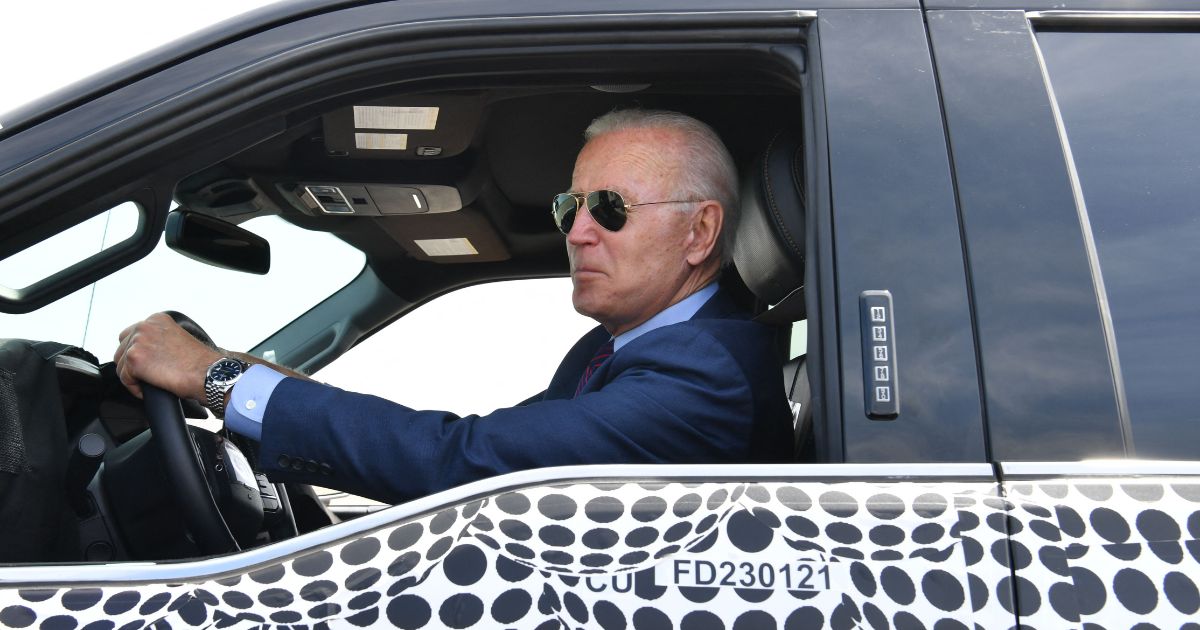 President Joe Biden drives the new electric Ford F-150 Lightning at the Ford Dearborn Development Center in Dearborn, Michigan on May 18, 2021.