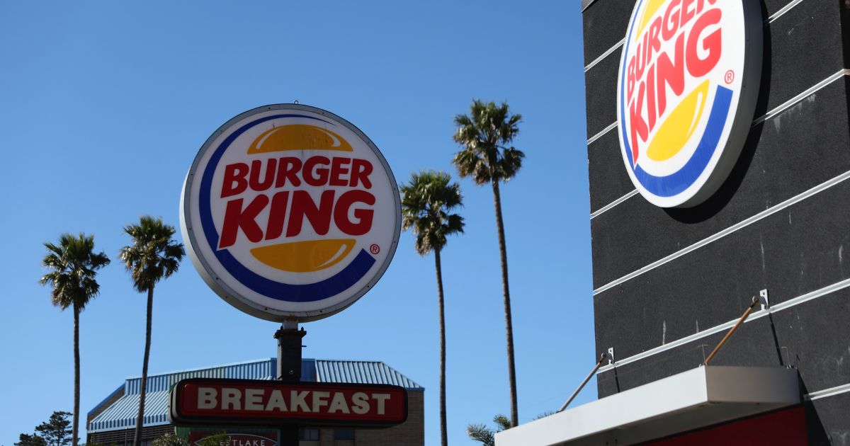 A sign is posted in front of a Burger King restaurant on Feb. 15 in Daly City, California.