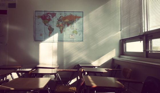 An empty classroom is seen in this stock image.