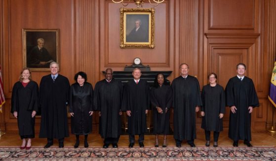 In this image provided by the Supreme Court, members of the Supreme Court pose for a photo during Associate Justice Ketanji Brown Jackson's formal investiture ceremony at the Supreme Court in Washington Sept. 30.