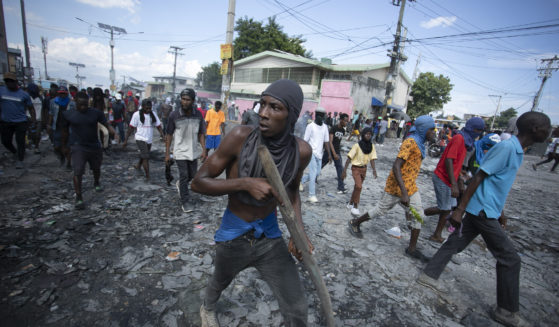 Protesters move through the streets in Port-au-Prince, Haiti, demanding the resignation of Prime Minister Ariel Henry on Monday.