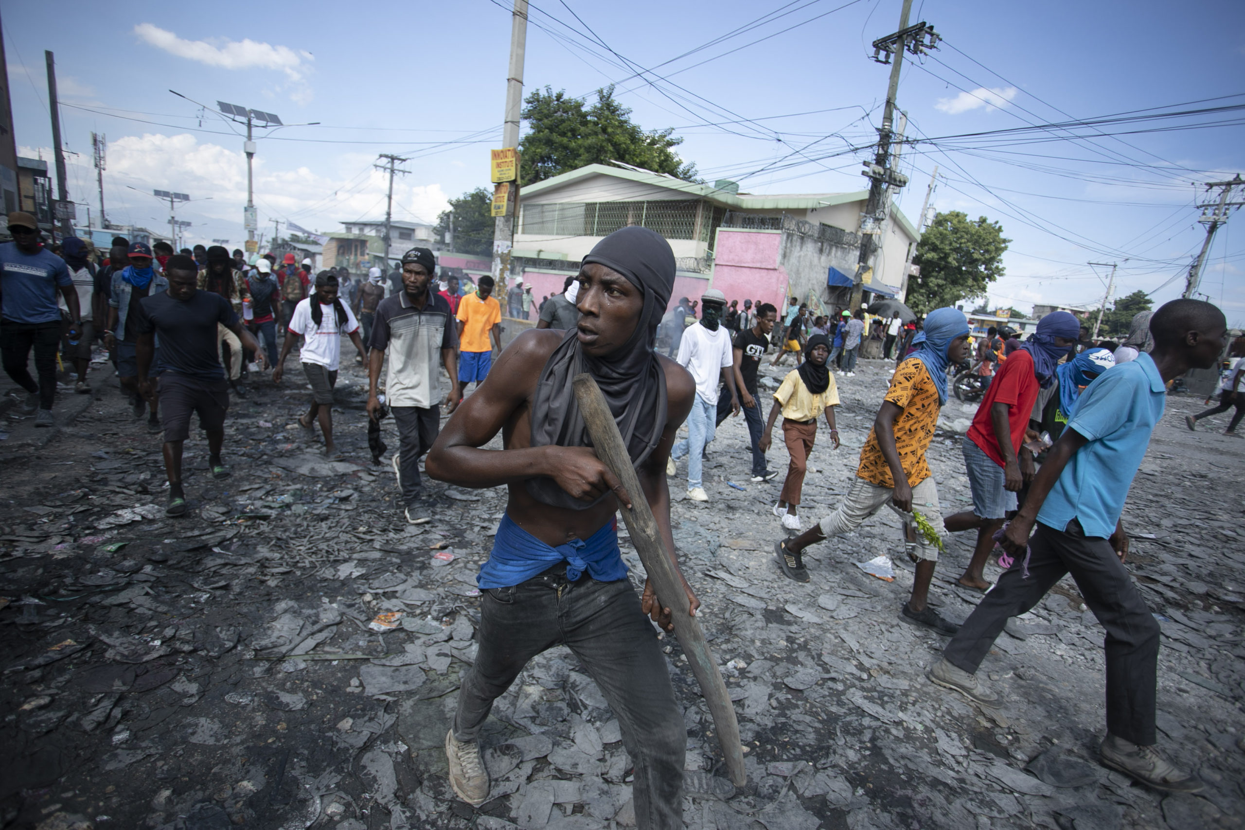 Protesters move through the streets in Port-au-Prince, Haiti, demanding the resignation of Prime Minister Ariel Henry on Monday.
