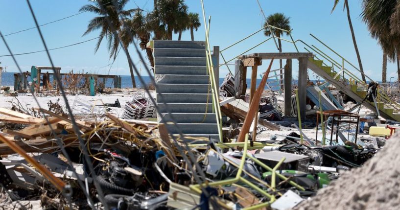 Stairways lead to nowhere after buildings were swept clear in the wake of Hurricane Ian on October 3, 2022 in Fort Myers Beach, Florida. The death toll in the state from Ian rose to at least 100 today following the storm making landfall as Category 4 hurricane, causing extensive damage along the coast as rescue crews continued the search for survivors. (Photo by Joe Raedle/Getty Images)