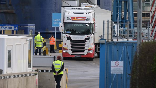 A customs official watched on as freight and goods lorries disembark from the Cairnryan, Scotland to Larne, Northern Ireland ferry without goods checks by customs officials on February 3, 2022 in Larne, Northern Ireland. (Photo by Charles McQuillan/Getty Images)