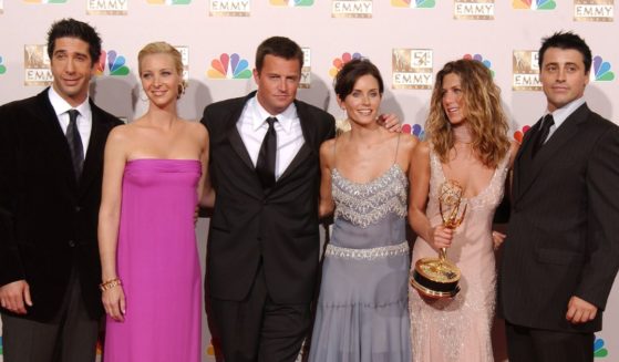 Actors David Schwimmer, Lisa Kudrow, Matthew Perry, Courteney Cox Arquette, Jennifer Aniston and Matt LeBlanc pose backstage during the 54th Annual Primetime Emmy Awards at the Shrine Auditorium on Sept. 22, 2002, in Los Angeles.