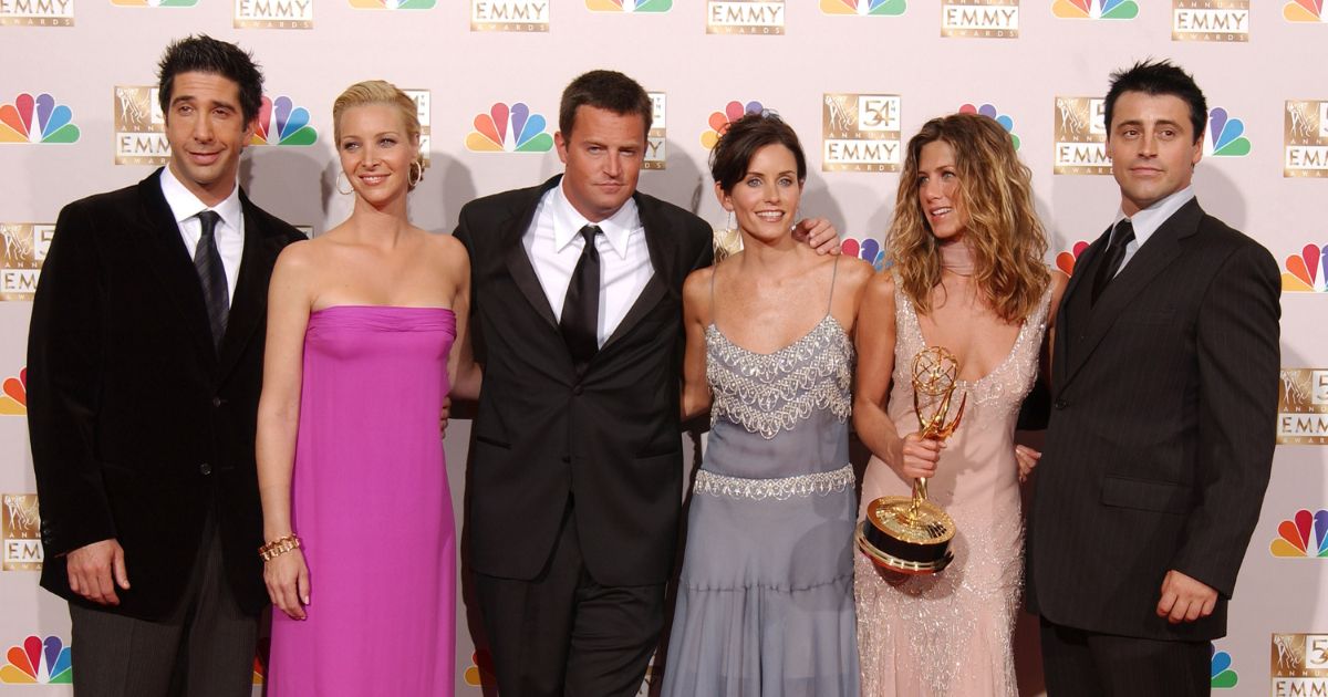Actors David Schwimmer, Lisa Kudrow, Matthew Perry, Courteney Cox Arquette, Jennifer Aniston and Matt LeBlanc pose backstage during the 54th Annual Primetime Emmy Awards at the Shrine Auditorium on Sept. 22, 2002, in Los Angeles.