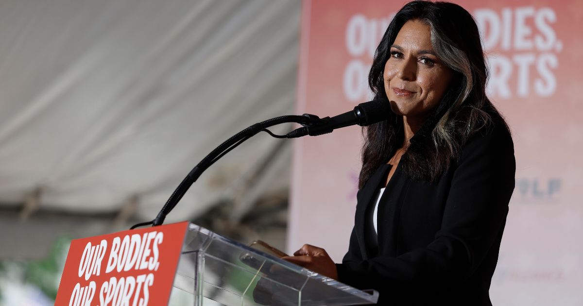 Former U.S. Rep. Tulsi Gabbard speaks at a "Our Bodies, Our Sports" rally to mark the 50th anniversary of Title IX at Freedom Plaza on June 23 in Washington, D.C.