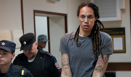 WNBA star and two-time Olympic gold medalist Brittney Griner is escorted from a courtroom after a hearing in Khimki just outside Moscow on Aug. 4.