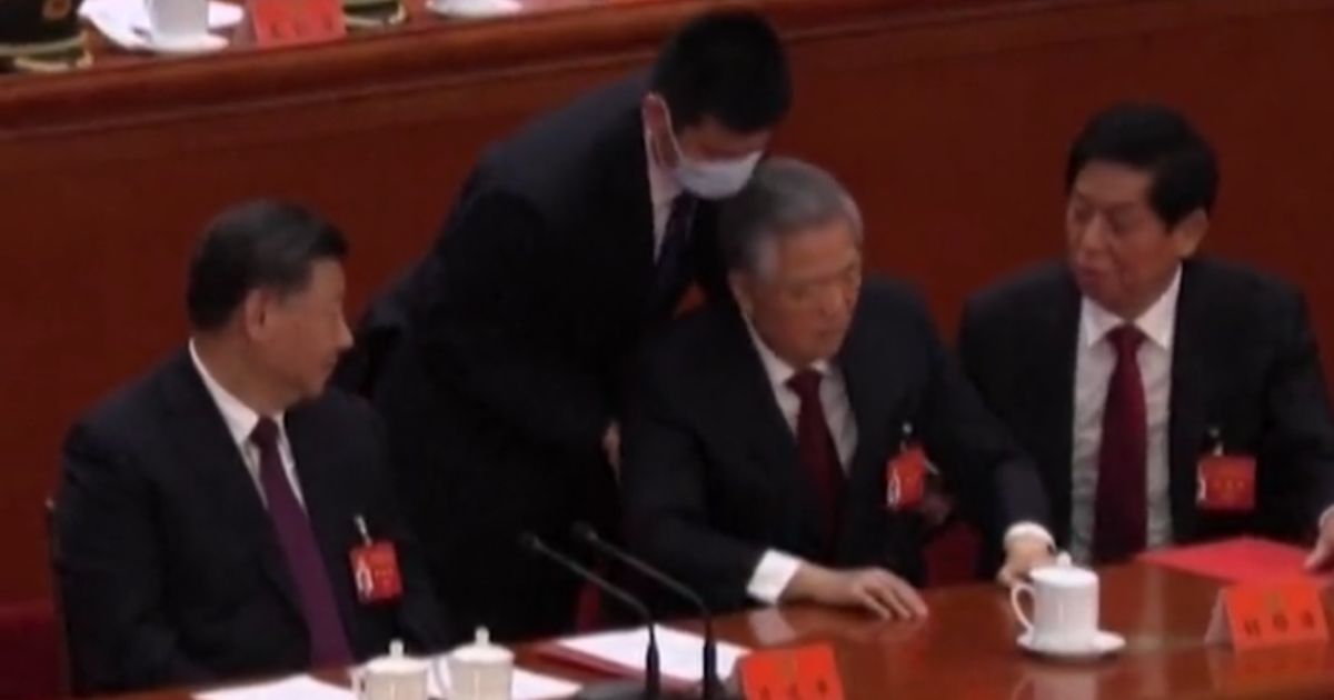 Former Chinese Hu Jintao is abruptly removed from a Communist party meeting in Beijing.