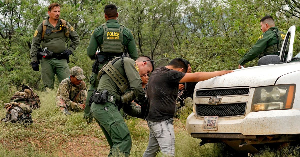 illegal immigrants are processed after being apprehended by U.S. Border Patrol agents