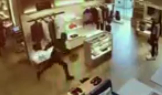 A thief attempts to escape a Louis Vuitton in Bellevue, Wa.