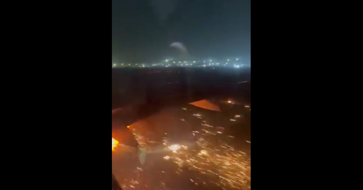 An airline passenger captured video of a plane engine catching fire as the aircraft began to take off in Delhi on Friday.