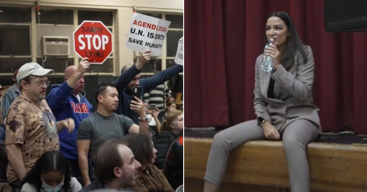Protesters show up for Democratic New York Rep. Alexandria Ocasio-Cortez's town hall in Queens.