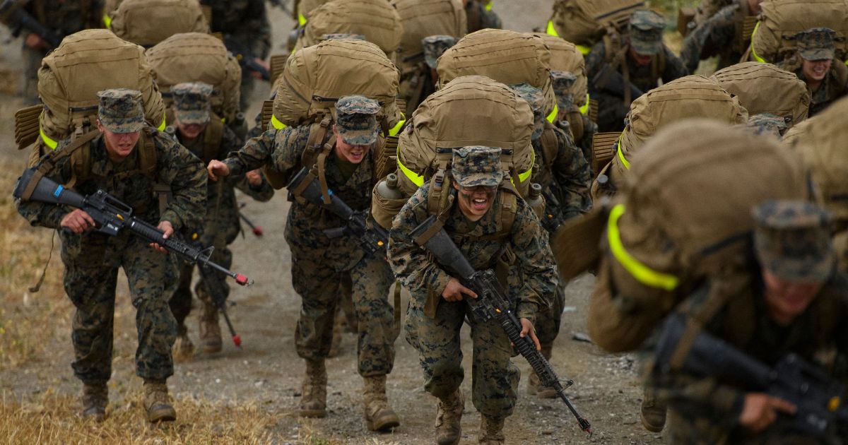 United States Marine Corps recruits complete their 9.7-mile hike on April 22, 2021, at Camp Pendleton in San Diego County, California.