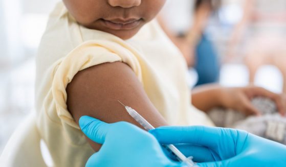 a child receiving a vaccine.