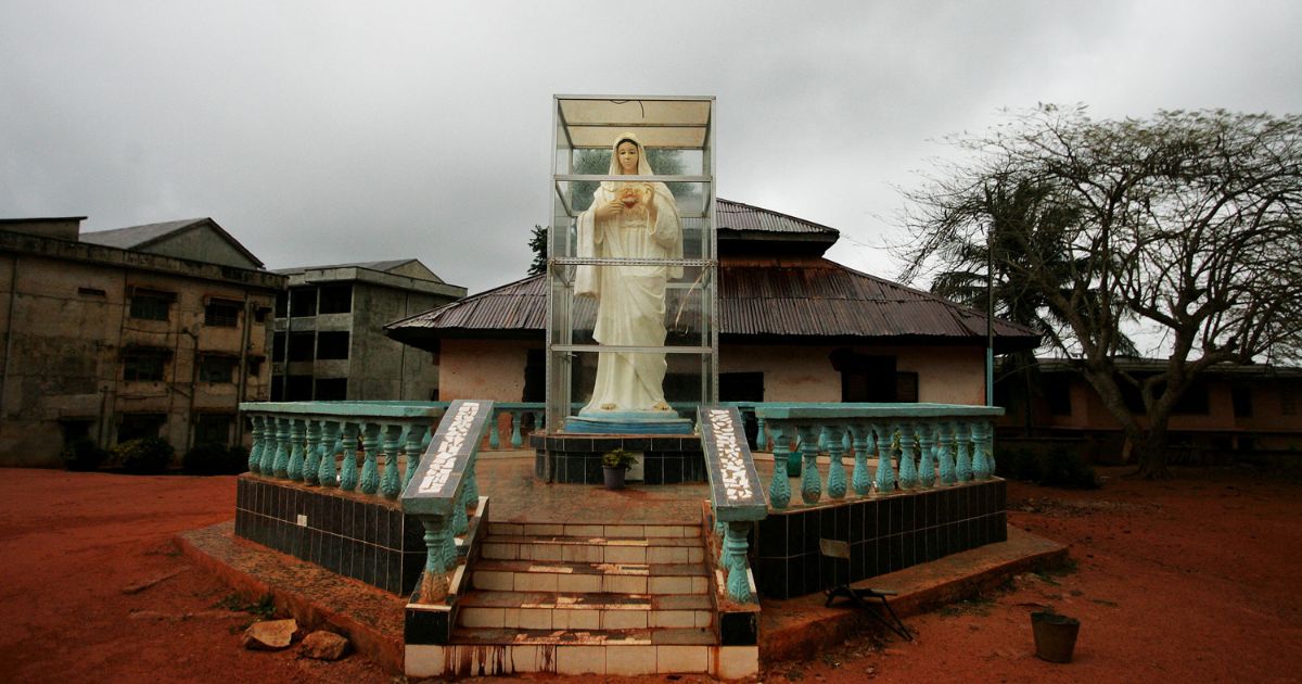 A statue of the Virgin Mary stands outside of St. Edward's Catholic Church, the main church in Cardinal Francis Arinze's home village April 14, 2005, in Eziowelle, Nigeria.