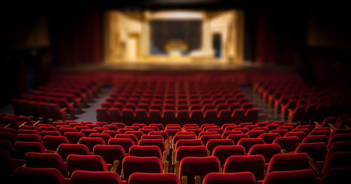 An empty theater is seen in the above stock image.