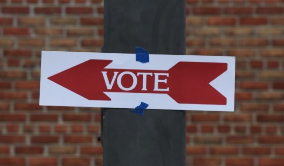 A sign for a polling station is seen during the midterm primary election on June 21 in Alexandria, Virginia.