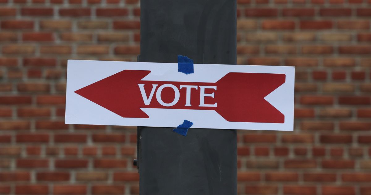 A sign for a polling station is seen during the midterm primary election on June 21 in Alexandria, Virginia.