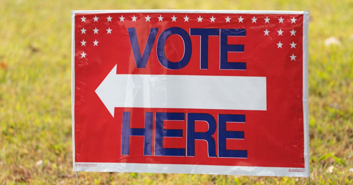 A sign is seen as early voting begins on Monday in Atlanta.