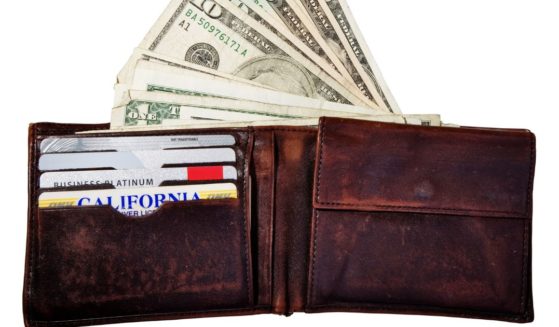 This stock photo pictures a wallet with credit cards and cash.
