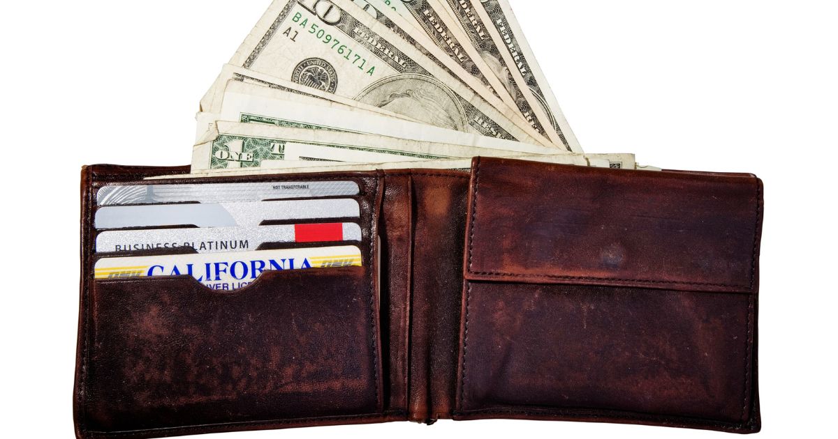 This stock photo pictures a wallet with credit cards and cash.