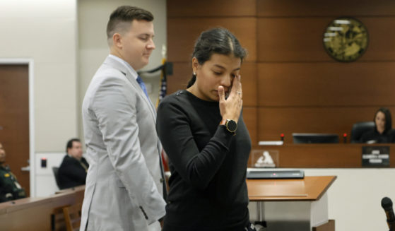 Ines Hixon, wipes away tears as she leaves the podium with her husband, Tommy Hixon, after she gave a victim impact statement during the sentencing for Parkland Killer Nikolas Cruz in Fort Lauderdale, Florida, on Tuesday.